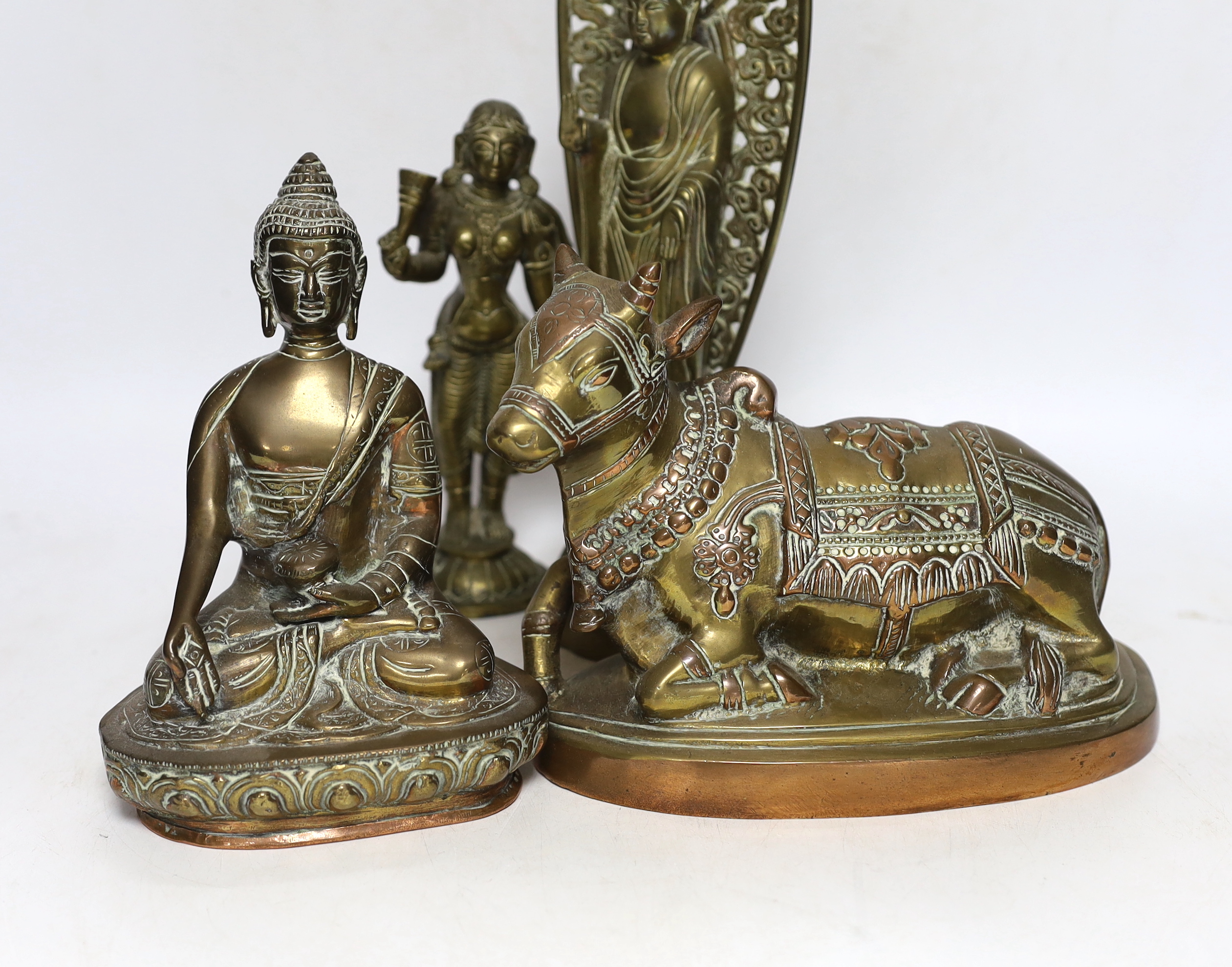 Four bronze deities and a Chinese copper pedestal bowl, tallest 29cm